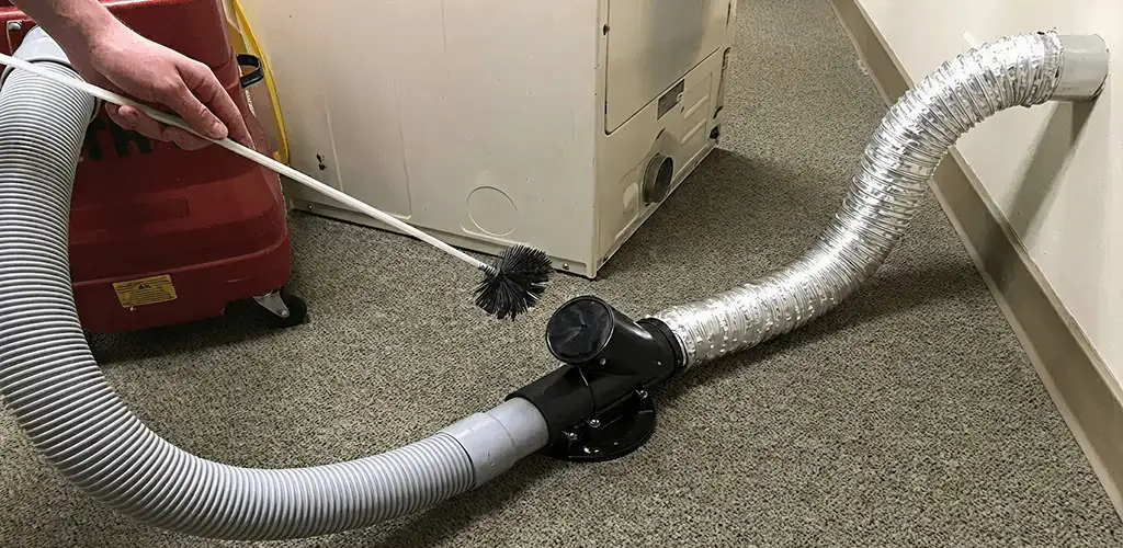 Dryer vent cleaning service removing lint from a dryer duct connection in Yonkers, NY