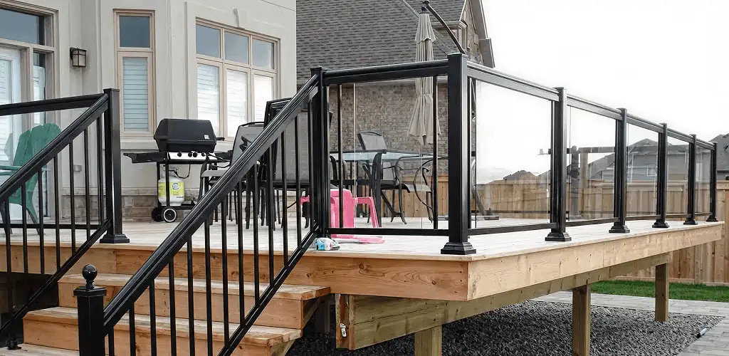 Handrail installation on a deck staircase for safety and code compliance in Yonkers, NY
