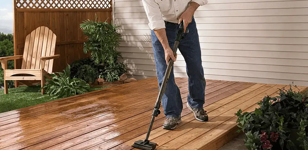 Deck staining service applying stain to a backyard wood deck in Yonkers, NY